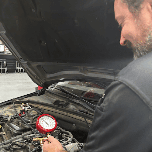 mechanic near me performing test on auto air conditioner on newer model audi car at Legend Motor Works in Colorado Springs, CO