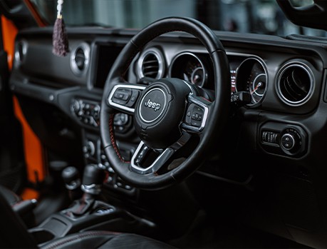 Jeep maintenance and repair near me in Colorado Springs, CO with Legend Motor Works. Interior view of a Jeep Wrangler Rubicon, showcasing quality maintenance and repair services.
