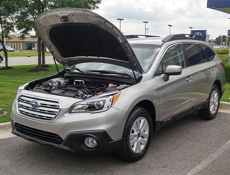 Subaru service and maintenance near me in Colorado Springs, CO with Legend Motor Works. Image of an open hood Subaru Outback displaying the engine bay, showcasing maintenance work done by Legend Motor Works.